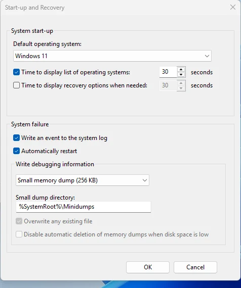 Windows Startup and Recovery window with the Automatically restart option ticked